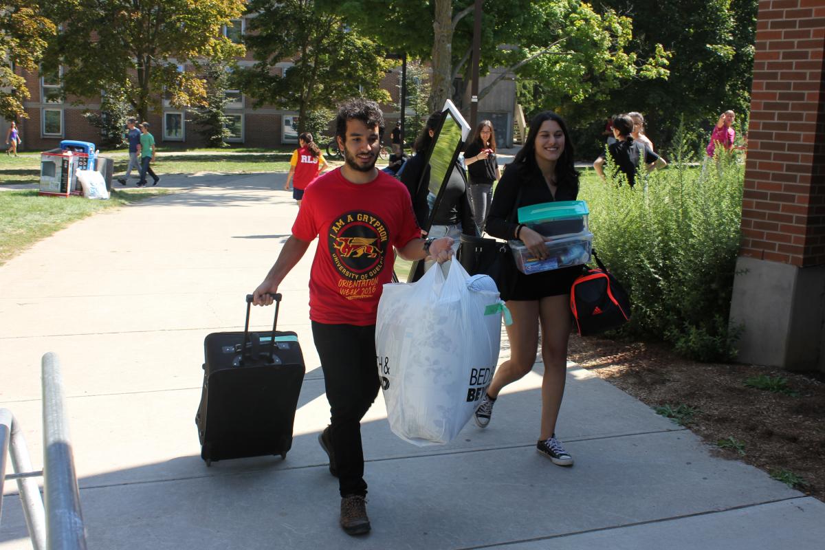 photo of students smiling on move-in day