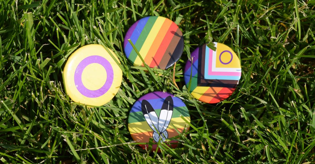 4 buttons with pride flags.