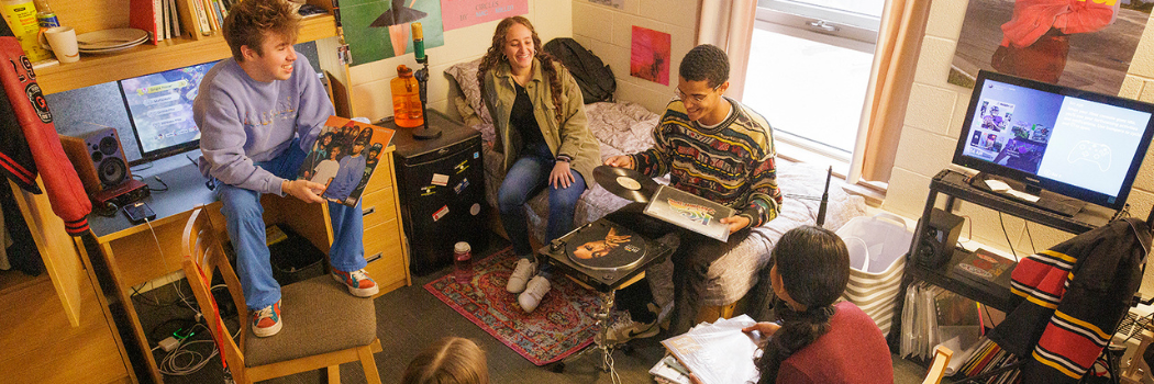 Students socializing in a Lennox Addington room