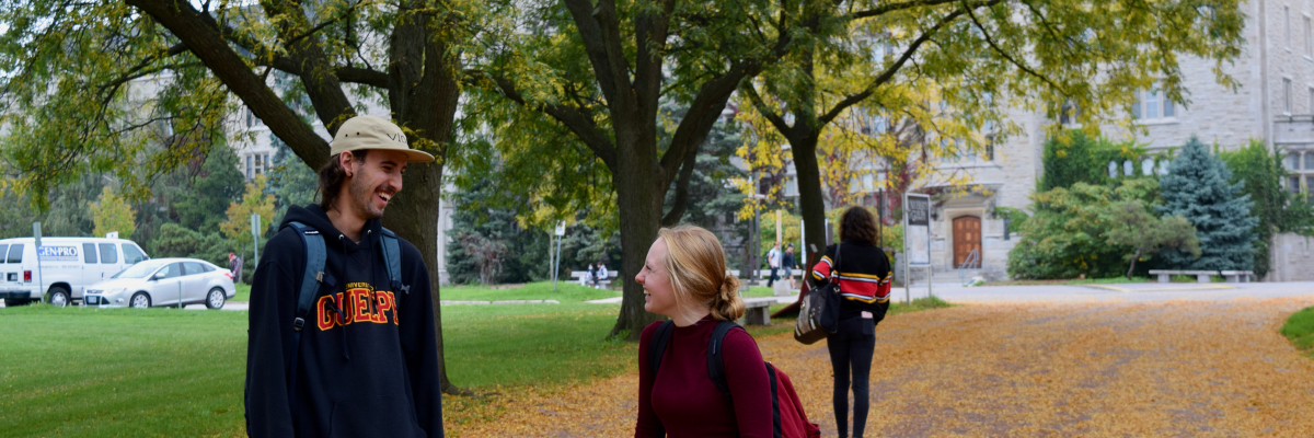 Students laughing near Johnston Green. 