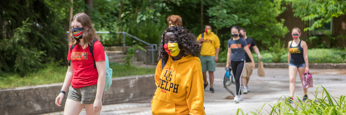 Students walking in masks outside Lambton Hall